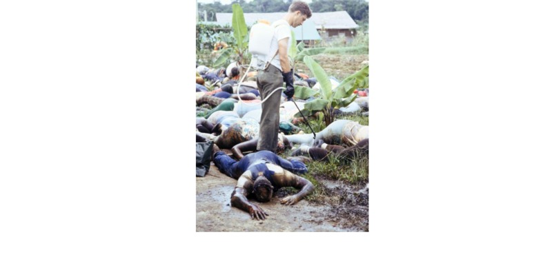 US Army Member Spraying Disinfectant Over Dead Bodies from Jonestown